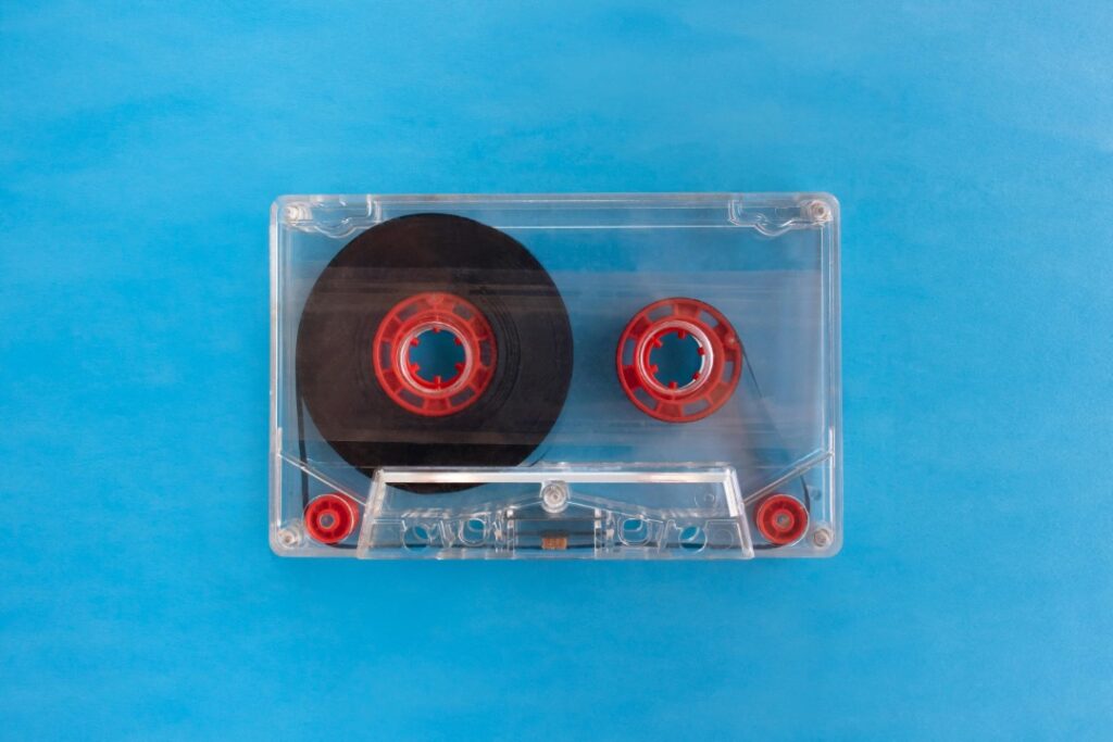 A transparent cassette on a blur background.